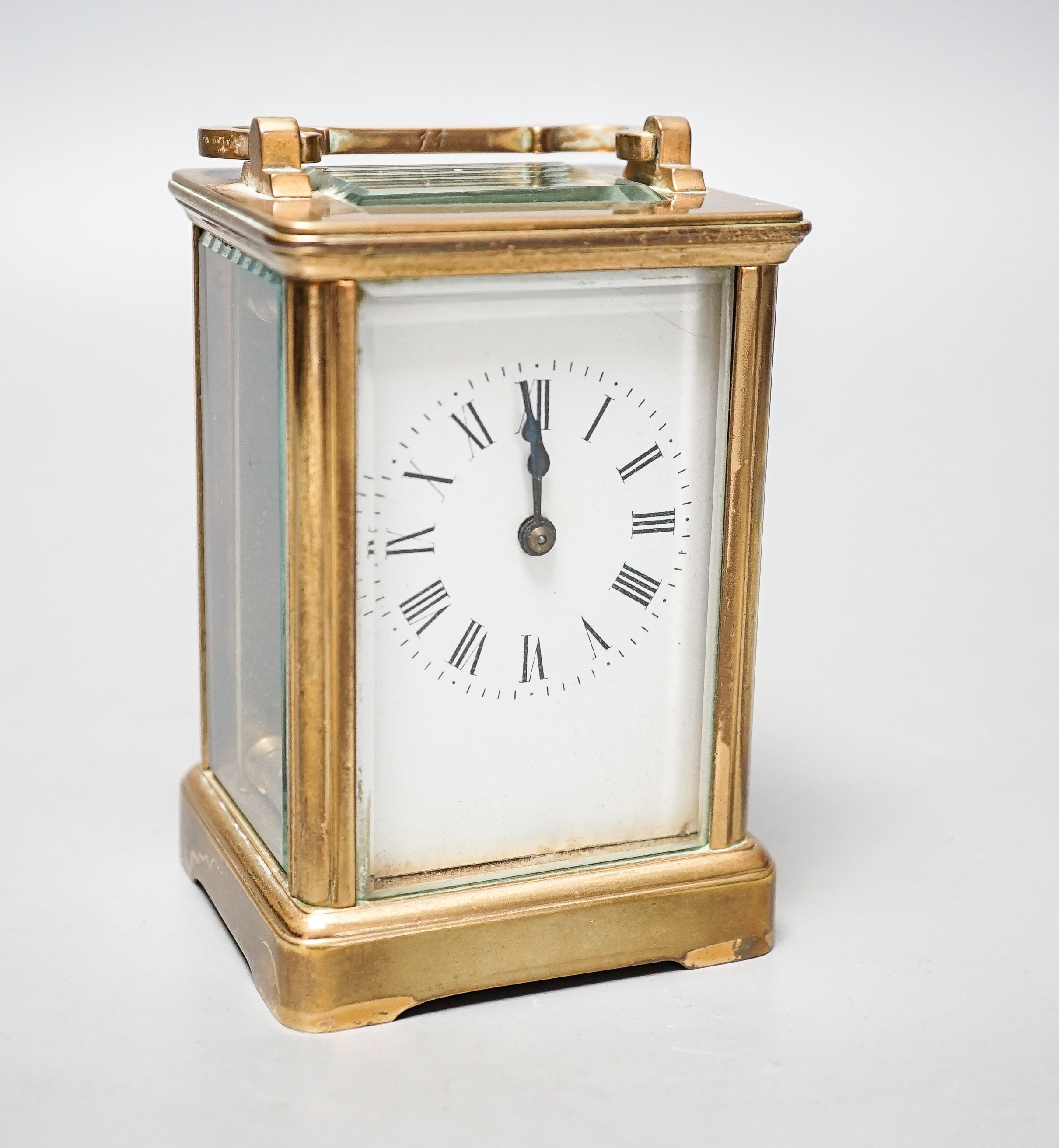 A brass cased French eight day carriage timepiece, 12cm high with key. *This lot is being sold in aid of the charity Prostate Cancer UK with 100% of the hammer price going to the charity”